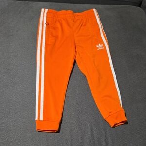 Adidas Kids Bright Orange Joggers with White Stripes